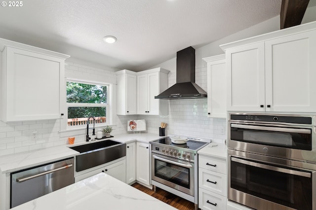 18891 Upper Midhill Dr, West Linn, OR 97068 - kitchen featuring appliances with stainless steel finishes, wall chimney exhaust hood, a sink, white cabinetry, and a textured ceiling