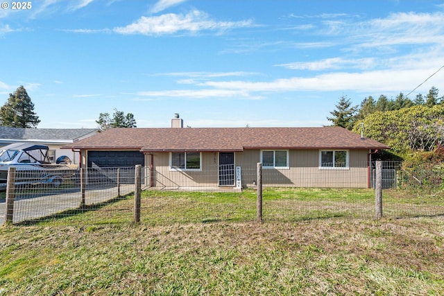 single story home featuring a garage and a front yard