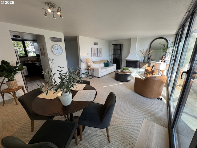 dining room featuring visible vents and carpet flooring