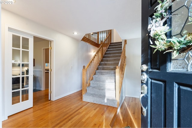 entryway featuring french doors and hardwood / wood-style floors