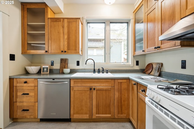 kitchen with glass insert cabinets, under cabinet range hood, white gas range oven, stainless steel dishwasher, and a sink