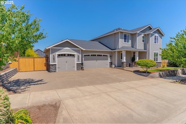 2871 Wing Tip Ave, Salem, OR 97304 - craftsman inspired home featuring an attached garage, concrete driveway, and stone siding