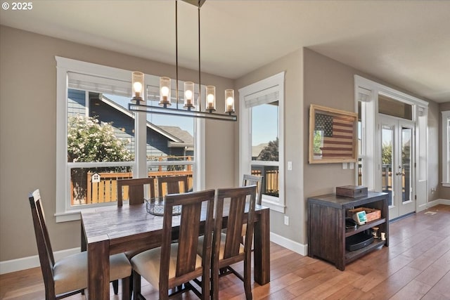 2871 Wing Tip Ave, Salem, OR 97304 - dining area with wood-type flooring, french doors, and a chandelier
