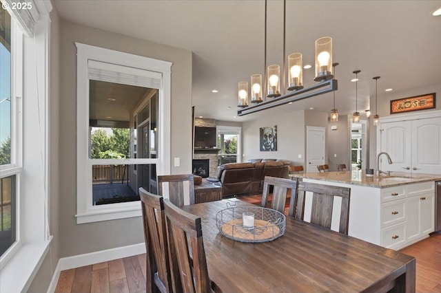 2871 Wing Tip Ave, Salem, OR 97304 - dining room with a fireplace, hardwood / wood-style flooring, and recessed lighting