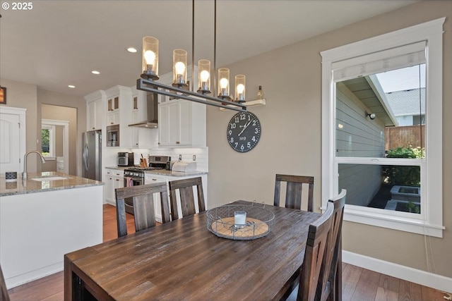 2871 Wing Tip Ave, Salem, OR 97304 - dining area featuring recessed lighting, wood finished floors, and a chandelier
