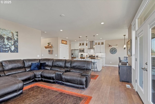2871 Wing Tip Ave, Salem, OR 97304 - living area with light wood finished floors and recessed lighting