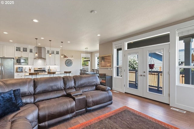 2871 Wing Tip Ave, Salem, OR 97304 - living room with french doors, hardwood / wood-style flooring, and recessed lighting