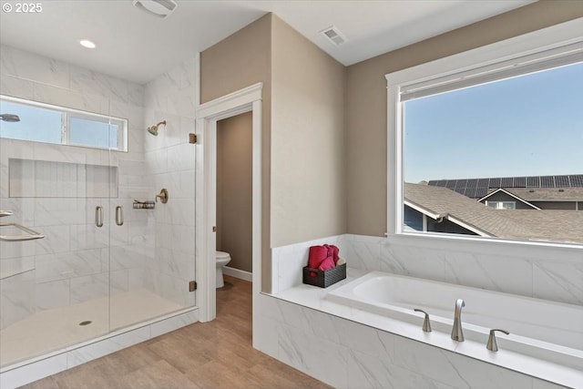2871 Wing Tip Ave, Salem, OR 97304 - bathroom with a garden tub, a stall shower, and wood finished floors