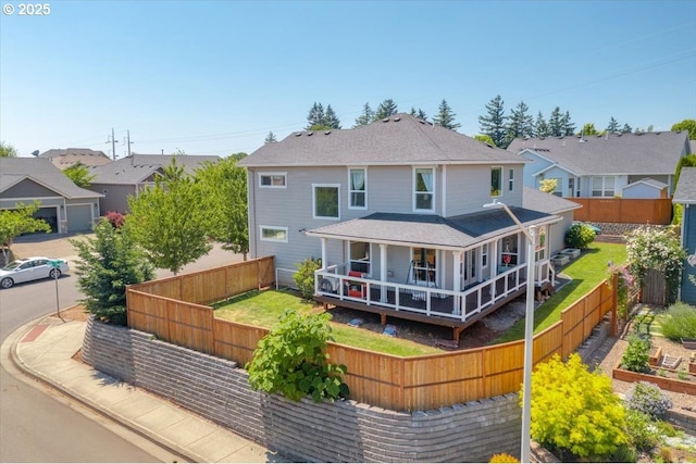 2871 Wing Tip Ave, Salem, OR 97304 - rear view of property with a fenced backyard, covered porch, roof with shingles, and a vegetable garden