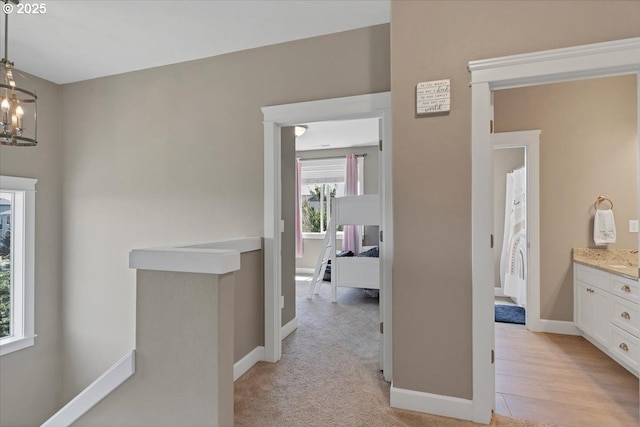 2871 Wing Tip Ave, Salem, OR 97304 - hall with baseboards and a chandelier