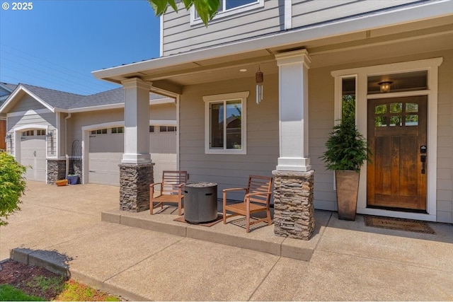 2871 Wing Tip Ave, Salem, OR 97304 - doorway to property featuring an attached garage, driveway, and covered porch