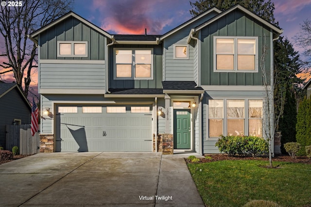 view of front facade featuring board and batten siding, stone siding, driveway, and an attached garage