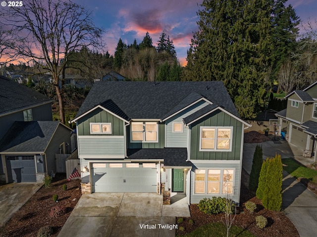 view of front of home featuring a garage, a shingled roof, fence, concrete driveway, and board and batten siding