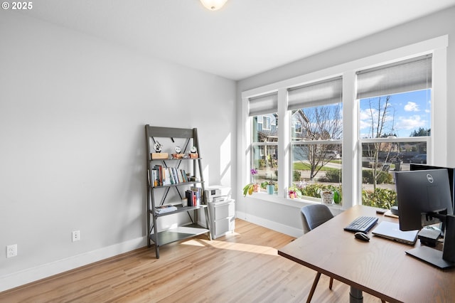 office area featuring wood finished floors and baseboards