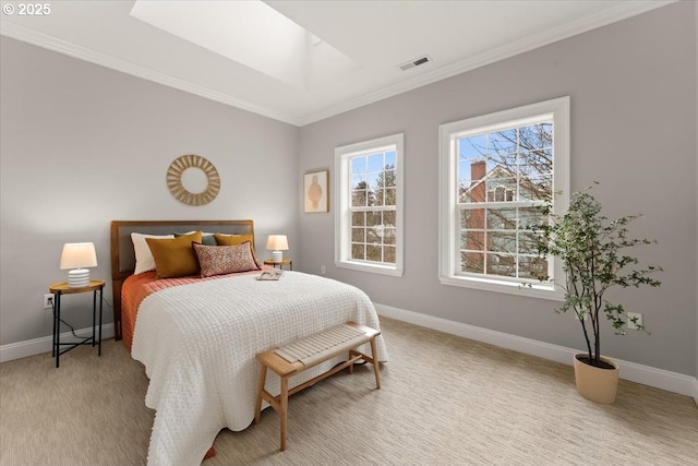 bedroom featuring light carpet, crown molding, and a skylight