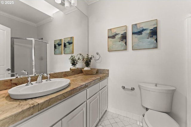 bathroom featuring toilet, a shower with shower door, crown molding, vanity, and tile patterned flooring