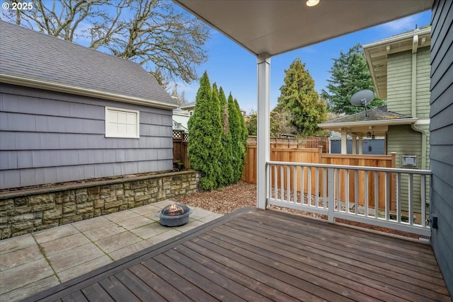 deck featuring an outdoor fire pit