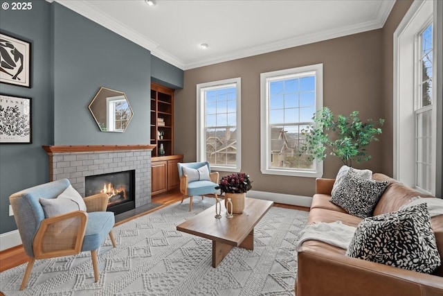 living room featuring plenty of natural light, light hardwood / wood-style floors, and a brick fireplace