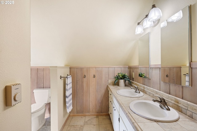2112 Agate St, Eugene, OR 97403 - full bathroom featuring double vanity and a wainscoted wall