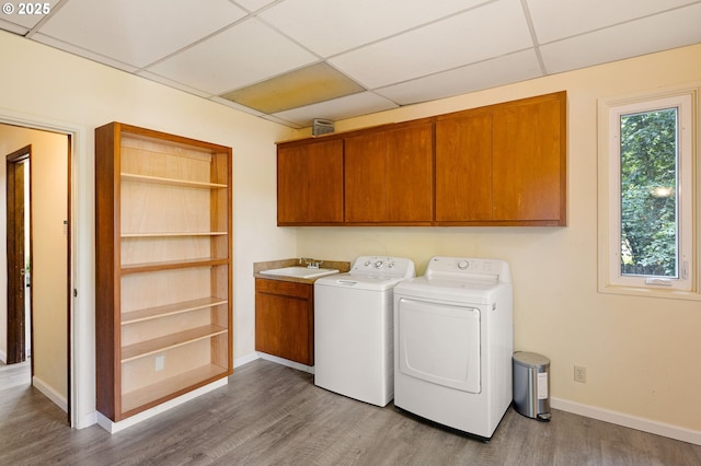 2112 Agate St, Eugene, OR 97403 - washroom featuring cabinet space, independent washer and dryer, and wood finished floors
