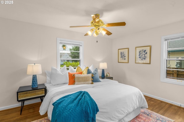 6356 N Omaha Ave, Portland, OR 97217 - bedroom featuring wood finished floors, baseboards, and a ceiling fan