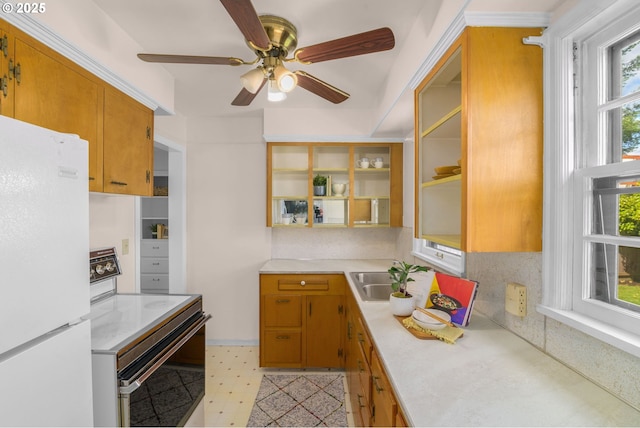 6356 N Omaha Ave, Portland, OR 97217 - kitchen featuring freestanding refrigerator, range with electric stovetop, a sink, light countertops, and a ceiling fan