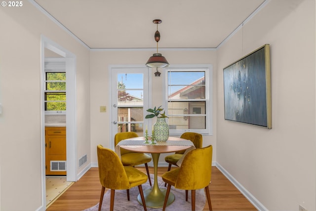 6356 N Omaha Ave, Portland, OR 97217 - dining area with light wood finished floors, healthy amount of natural light, and baseboards
