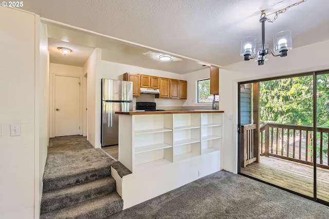 12140 SE Henderson Dr, Portland, OR 97266 - kitchen with freestanding refrigerator, under cabinet range hood, range, light carpet, and open shelves