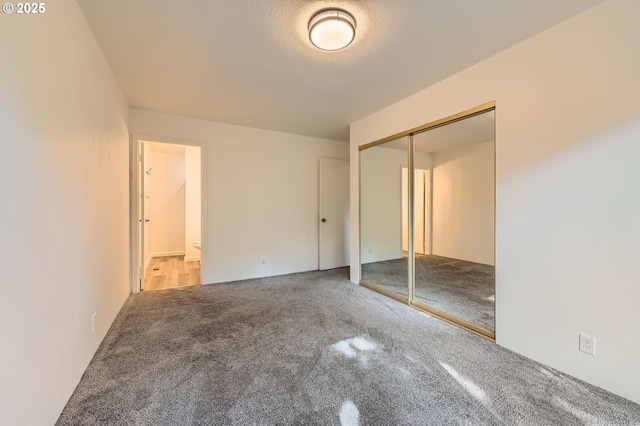 12140 SE Henderson Dr, Portland, OR 97266 - unfurnished bedroom featuring carpet, a closet, and connected bathroom