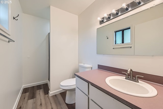 12140 SE Henderson Dr, Portland, OR 97266 - bathroom featuring wood finished floors, vanity, and a shower