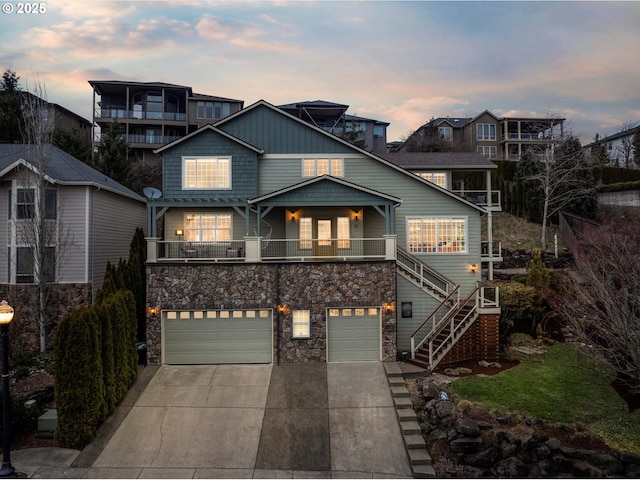 view of front facade with a garage and a balcony