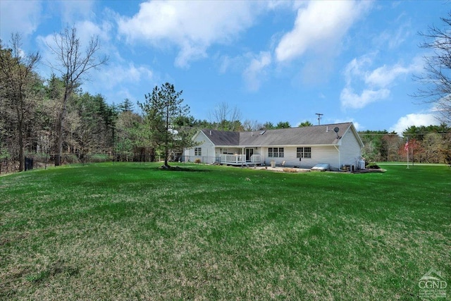 back of house featuring a yard