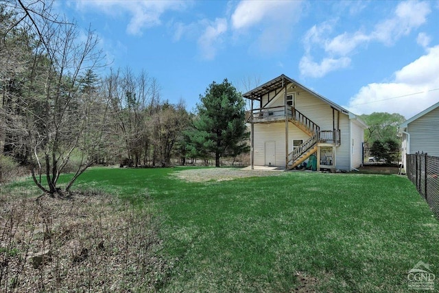 view of yard featuring stairs and fence