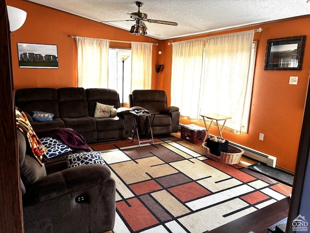 living room featuring ceiling fan, crown molding, and a textured ceiling