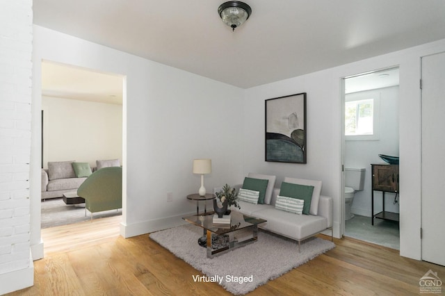 living area with light hardwood / wood-style flooring