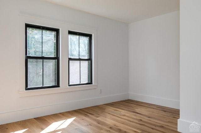 spare room featuring light hardwood / wood-style flooring