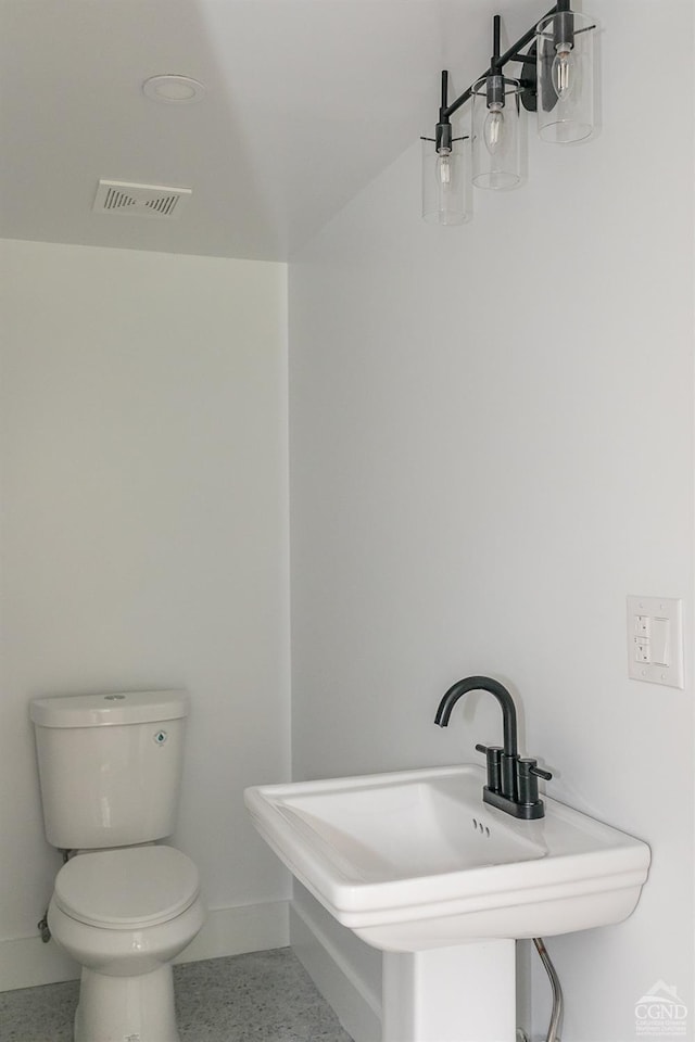 bathroom with toilet and sink