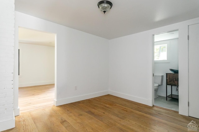 spare room featuring light hardwood / wood-style flooring