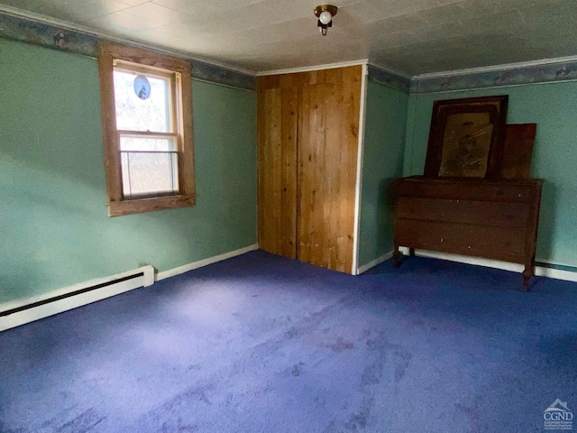 unfurnished bedroom with dark carpet, crown molding, and a baseboard radiator