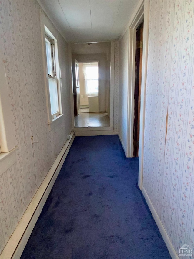 hallway featuring carpet floors and baseboard heating