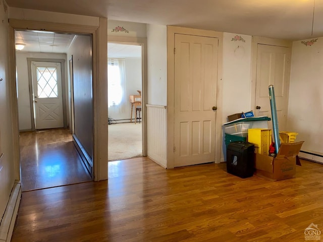 entryway featuring a baseboard radiator and dark hardwood / wood-style floors