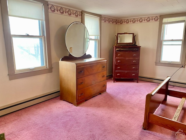 sitting room with baseboard heating and light colored carpet