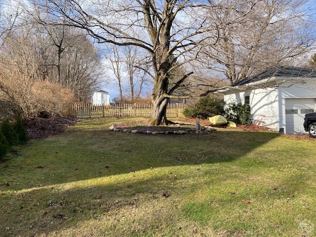 view of yard featuring a garage