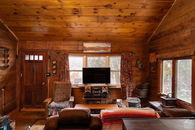 living area with wooden ceiling, vaulted ceiling, and wood finished floors