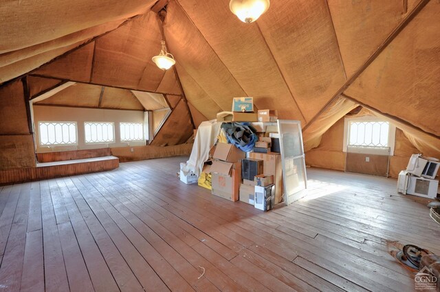 bonus room featuring vaulted ceiling and hardwood / wood-style flooring