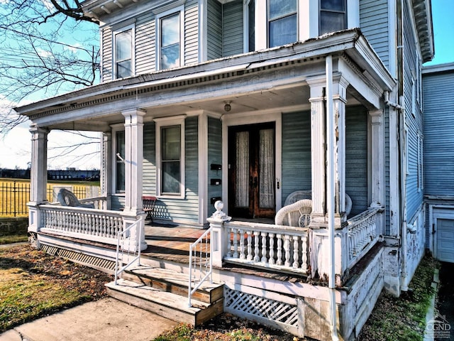 property entrance featuring a porch