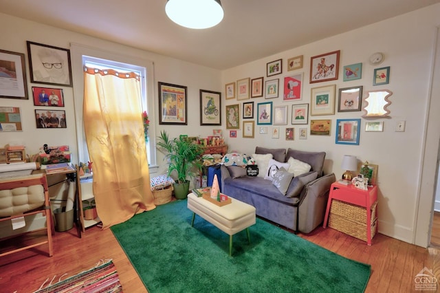 living area with hardwood / wood-style flooring