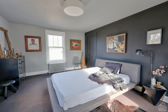 bedroom featuring dark carpet and radiator