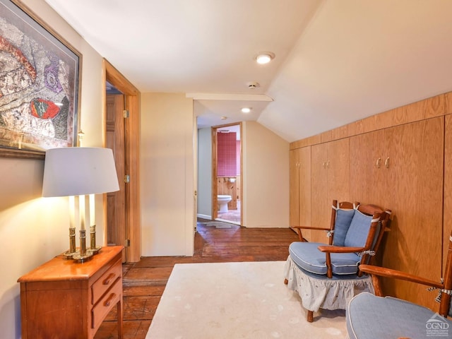 sitting room featuring vaulted ceiling and wood finished floors