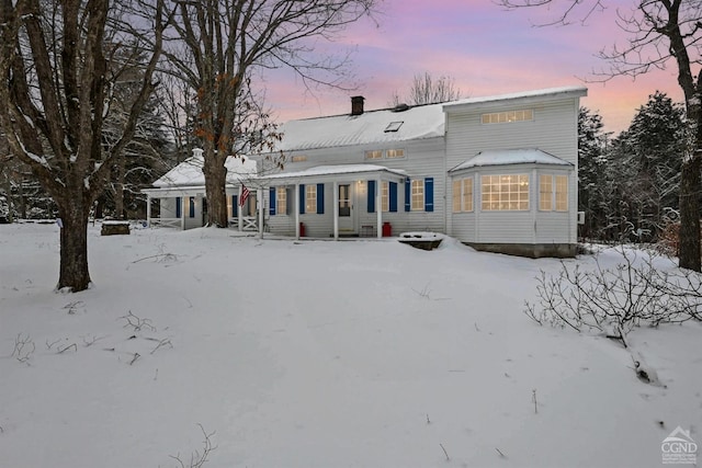 view of snow covered house